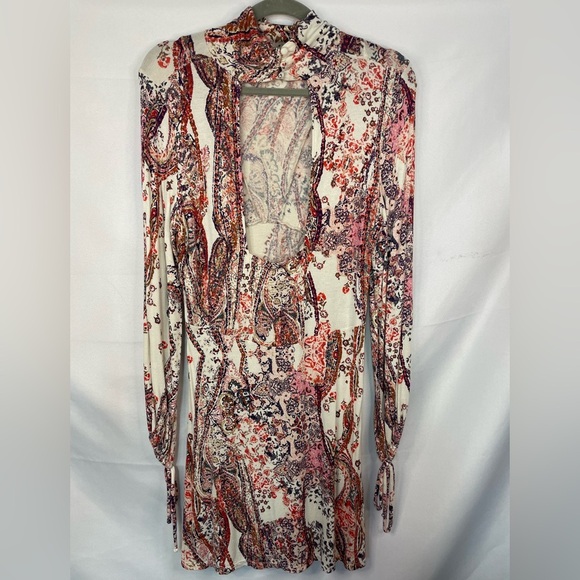 Boho and Gypsy style dress by Free People. Has an open back and elastic sleeves. - Picture 4 of 6